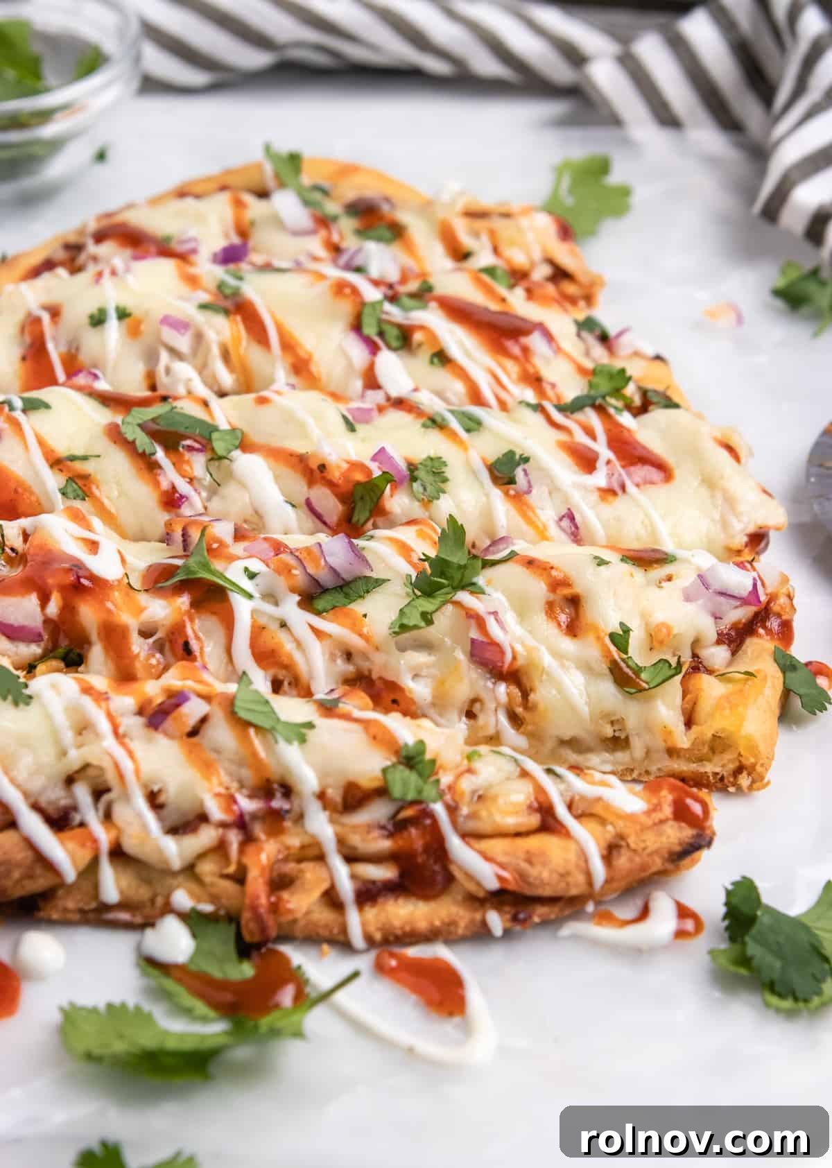 Smoky BBQ Ranch Chicken Flatbread 2 Delicious BBQ chicken flatbread garnished with fresh cilantro, ready to be served as a quick dinner or appetizer.