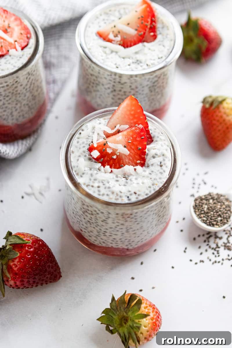 Creamy Coconut Vanilla Chia Pudding with Strawberries 2 Chia pudding in a jar with coconut and strawberries on top.