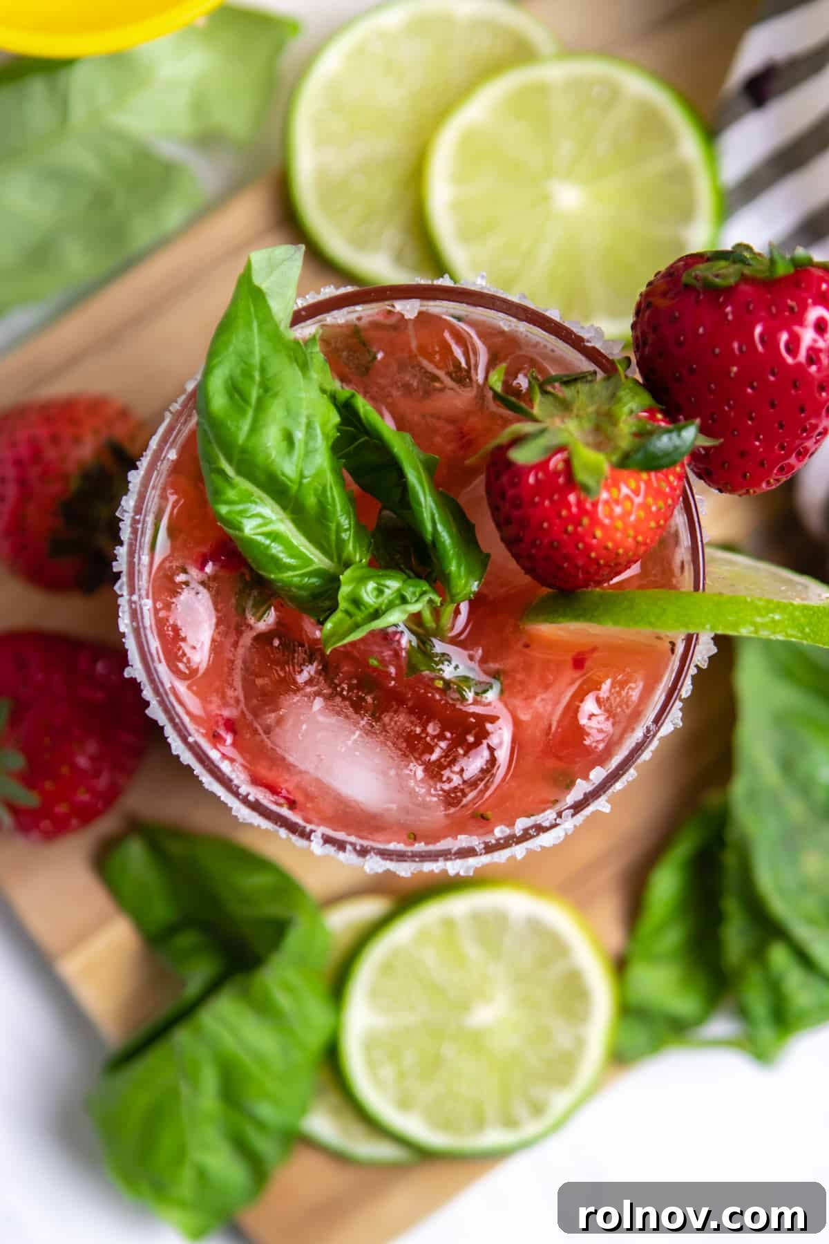 Garden Fresh Strawberry Basil Margarita 8 Overhead view of strawberry margarita with basil, lime and strawberry garnish.
