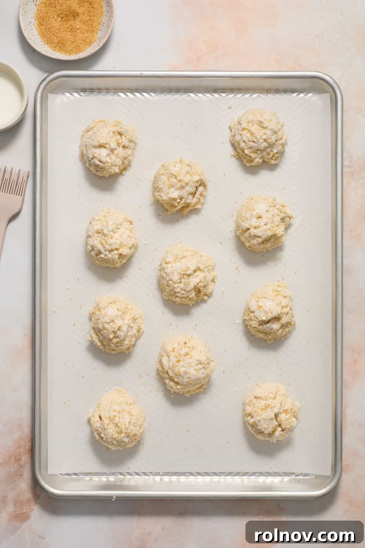 Sun-Kissed Peach Strawberry Shortcake 9 Biscuit dough dropped on parchment lined sheet pan.