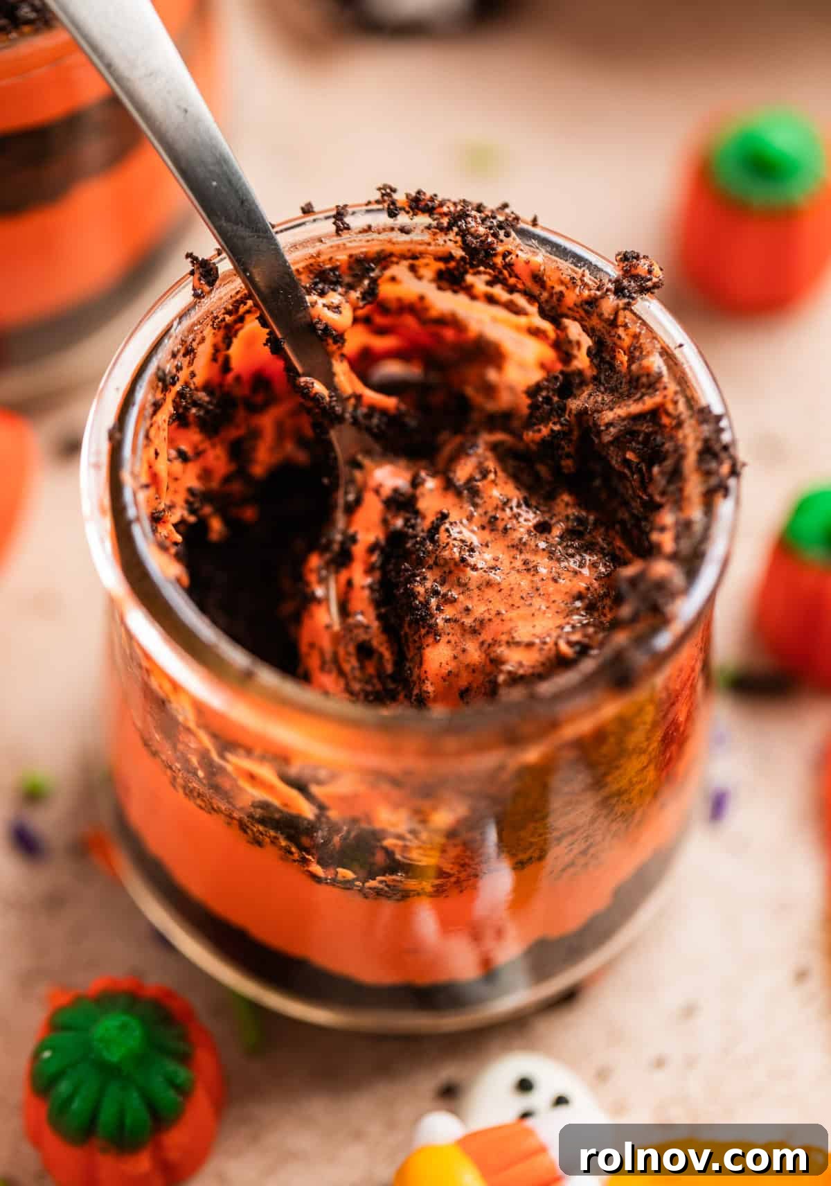 Halloween Oreo Graveyard Cake 8 Halloween dirt cake cup with spoon in cup.