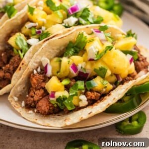 Zesty Pork Tacos with Fresh Pineapple Salsa 10 Ground pork tacos in tortillas topped with pineapple, jalapeño and cilantro salsa.