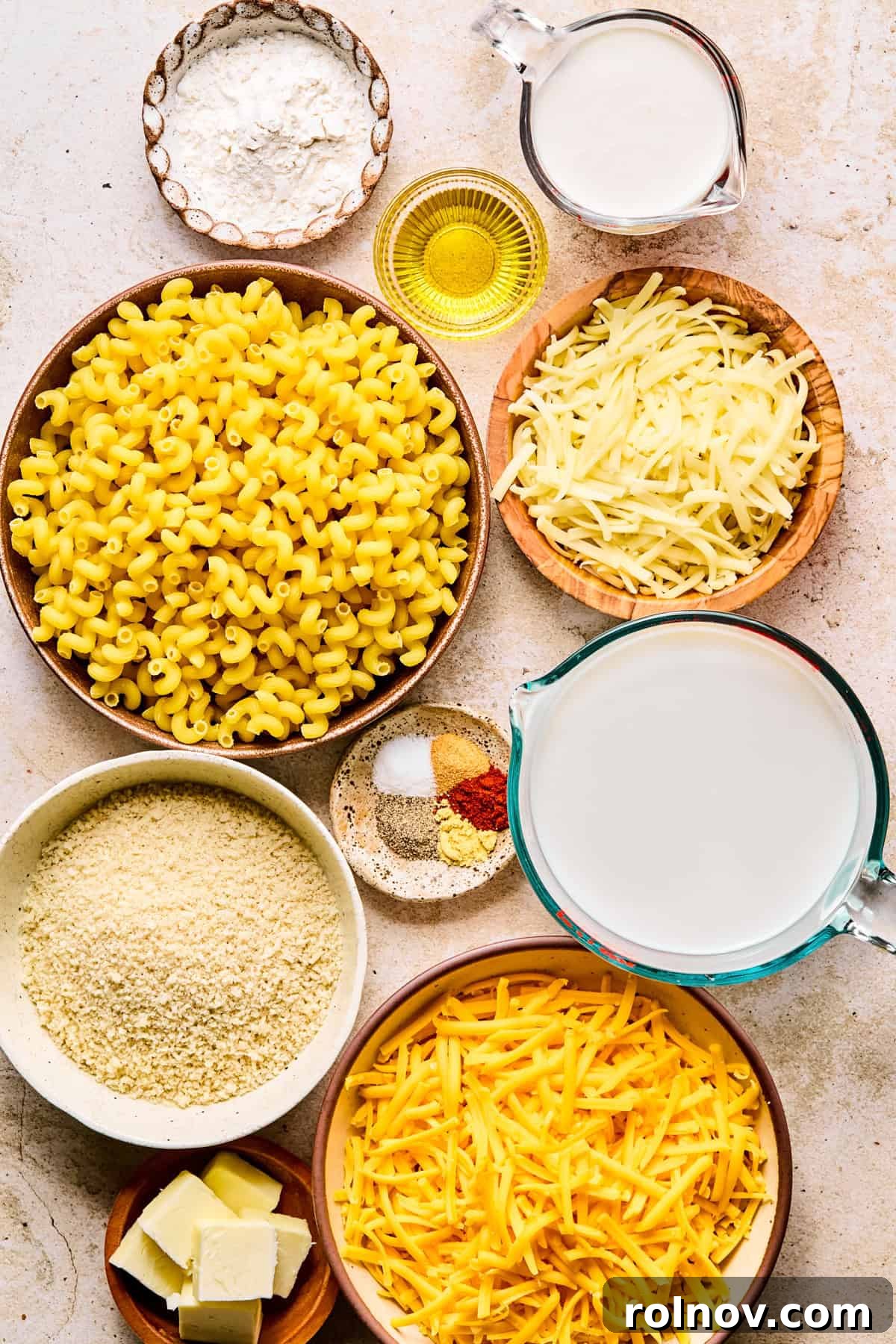 Gourmet Cheddar Gruyère Mac and Cheese 3 Pasta, shredded cheese, milk and other ingredients to make recipe.