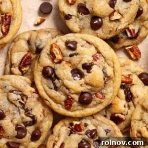 Chocolate chip pecan cookies arranged on surface.