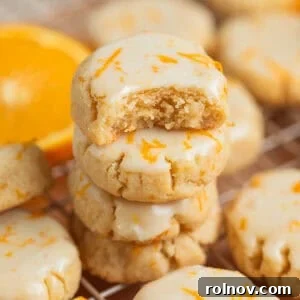 Stack of gluten free almond flour cookies with bite taken out of top cookie.