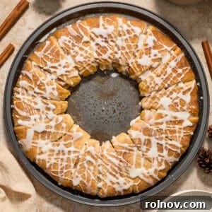 Delicious cinnamon crescent wreath with cream cheese icing, perfect for holiday mornings.