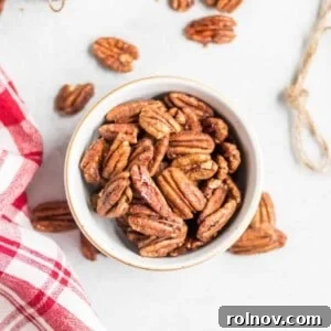 A inviting bowl of sugar-dusted maple vanilla spiced pecans, a perfect homemade snack or gift.