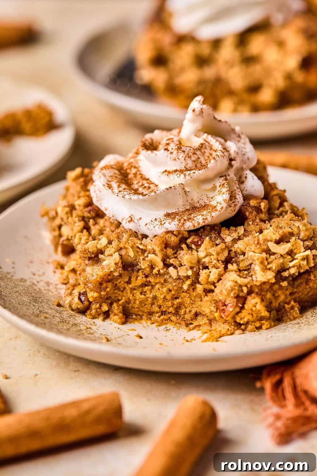 Spiced Pumpkin Crumble 13 Piece of pumpkin crisp on dish with portion eaten.
