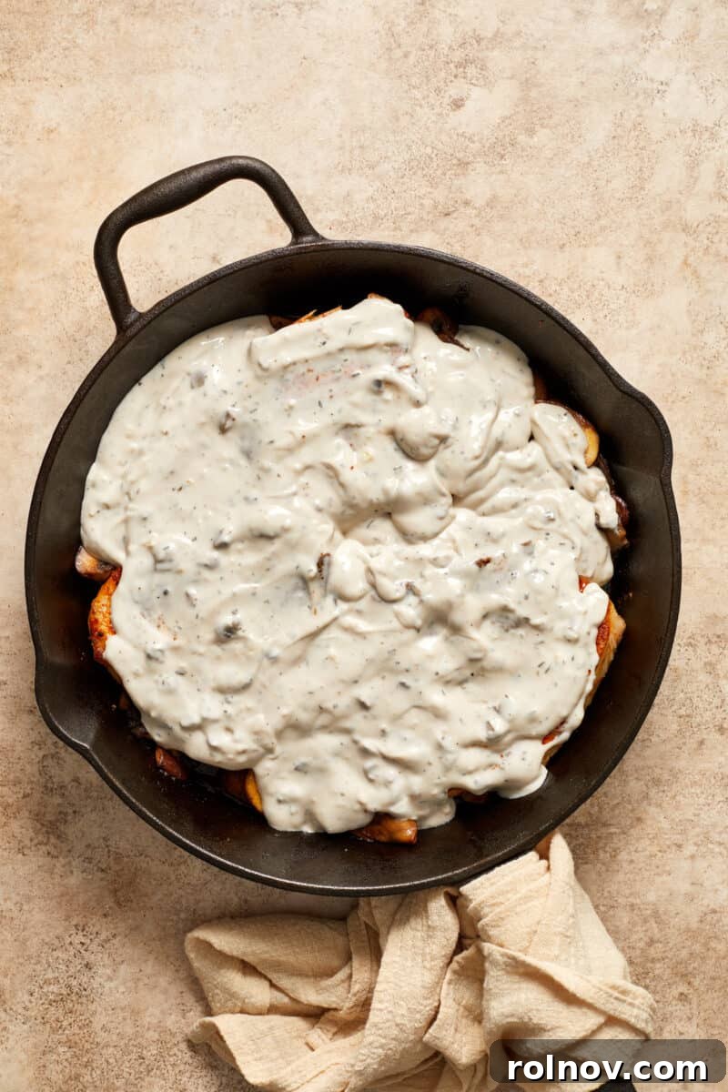 Velvety Mushroom Pork Chops 11 Cream of mushroom soup over pork chops and mushrooms in skillet.