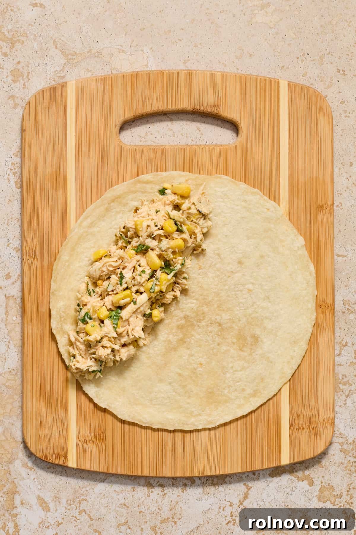 Zesty Verde Chicken Enchiladas 6 Chicken enchilada mixture on tortilla.