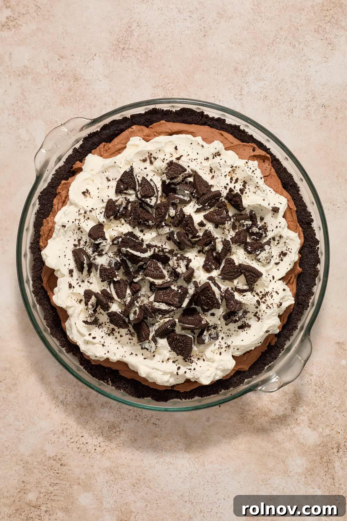 Velvety No Bake Chocolate Pie 13 Whipped cream and crushed Oreos on top of no bake chocolate pie.