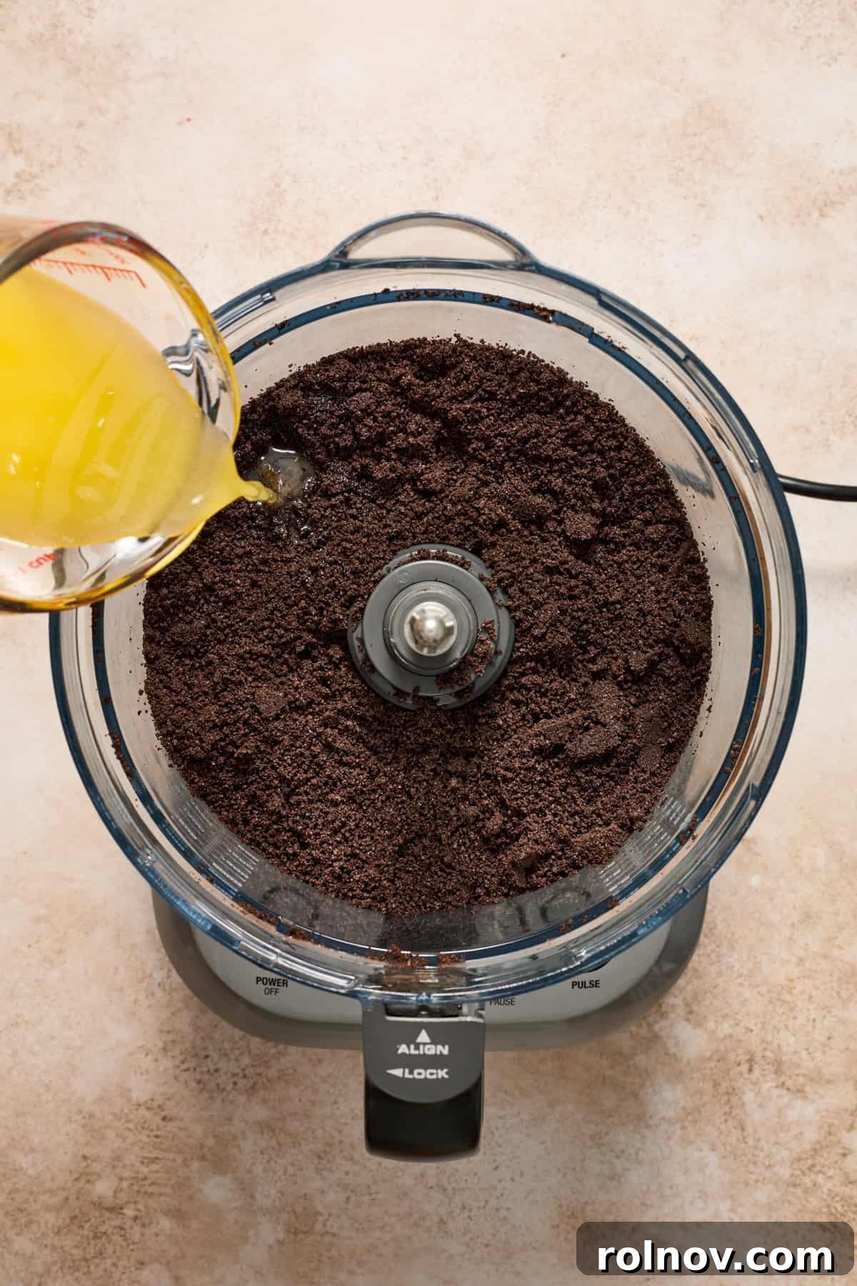 Velvety No Bake Chocolate Pie 6 Food processor with crushed cookies and melted butter poured in.