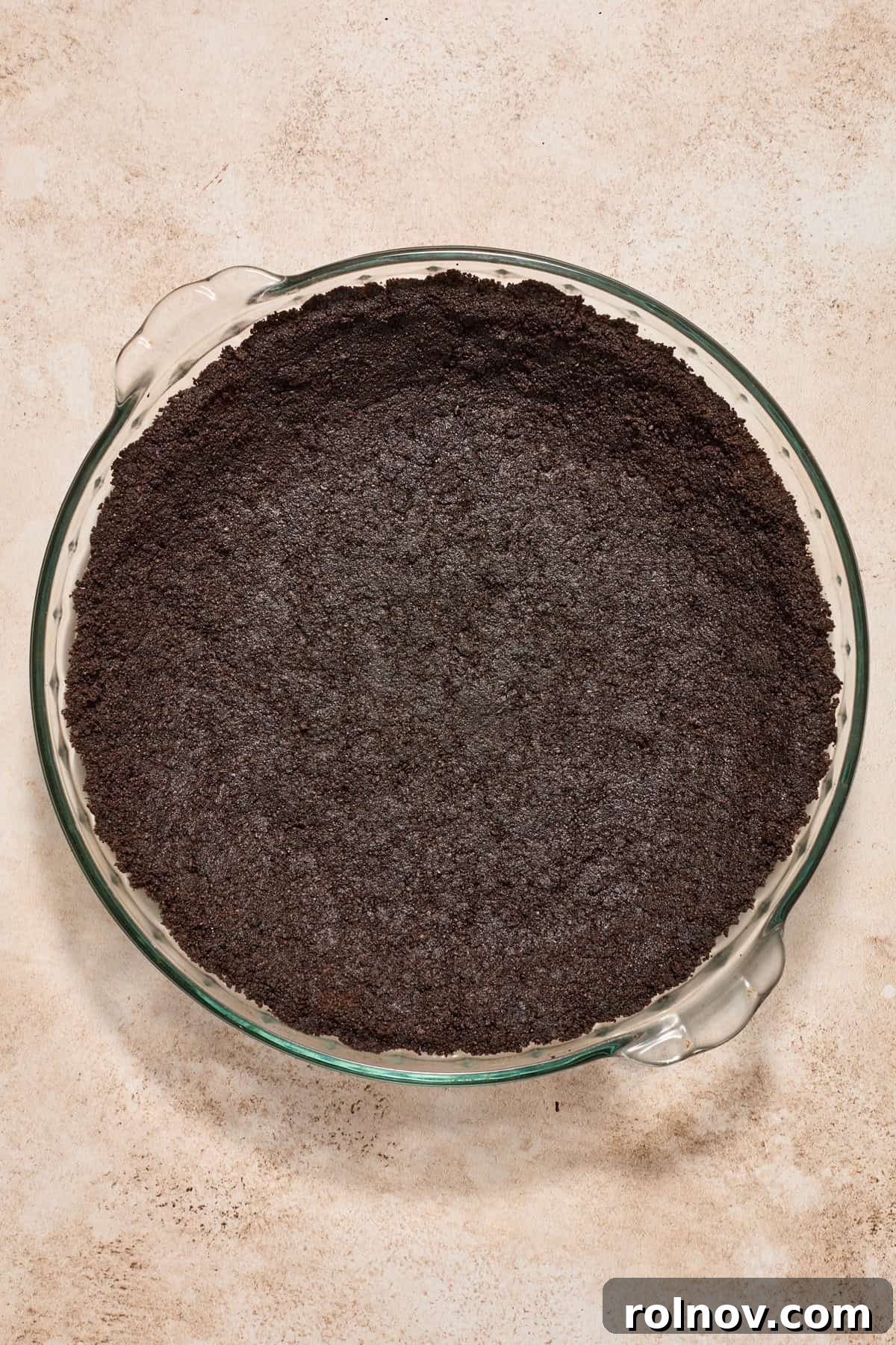 Velvety No Bake Chocolate Pie 8 Oreo crust pressed into pie dish.