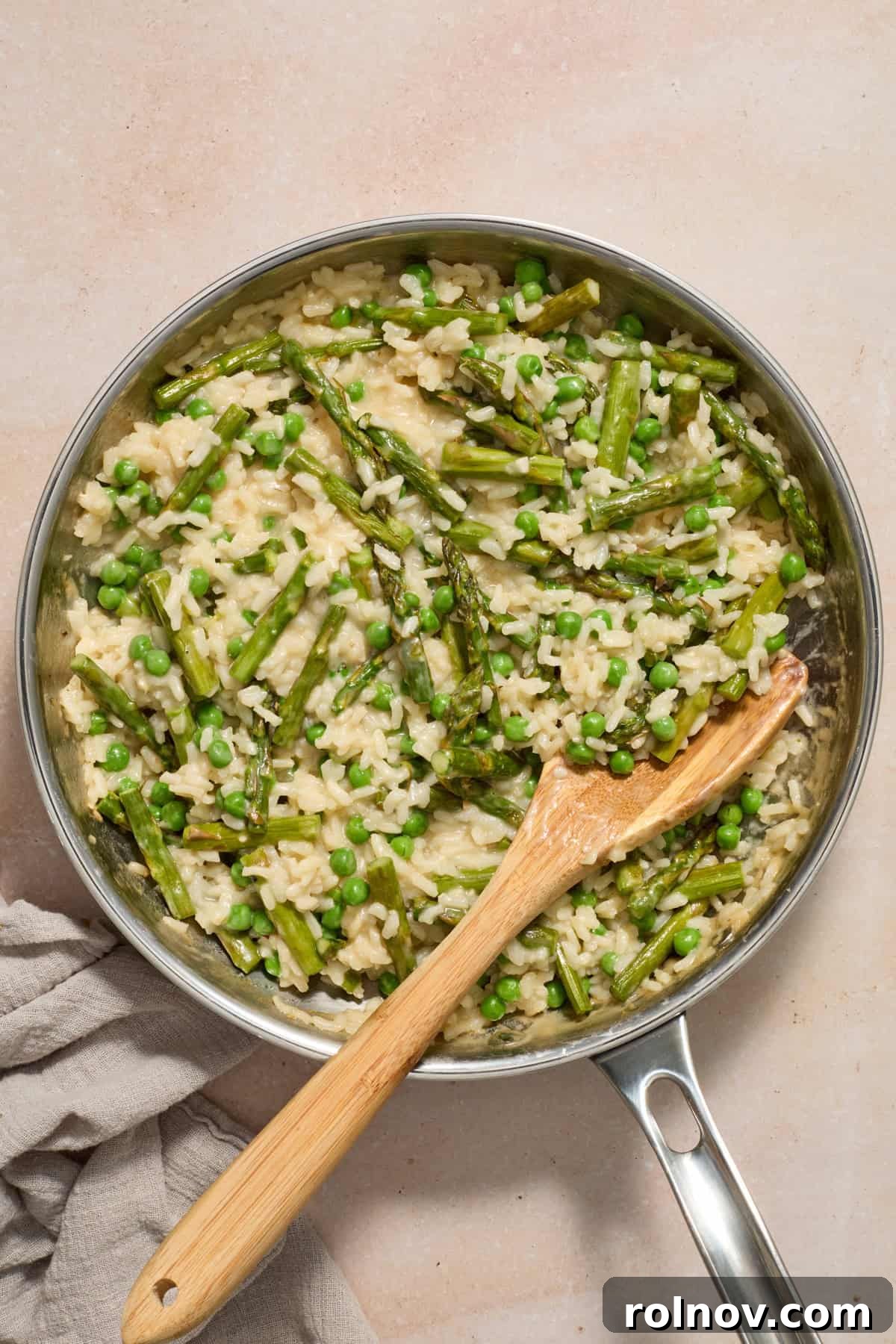 Springtime Pea and Asparagus Risotto 12 Pea and asparagus risotto in pan with towel beside pan.
