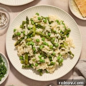 Plate with risotto with spring peas and asparagus.