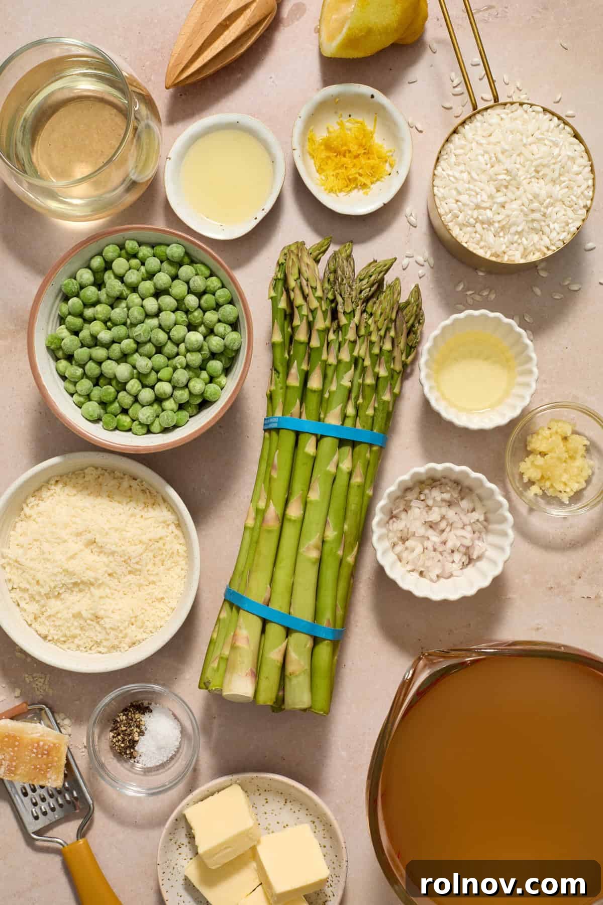 Springtime Pea and Asparagus Risotto 3 Asparagus, broth, parmesan, broth, white wine and other ingredients prepped for recipe.