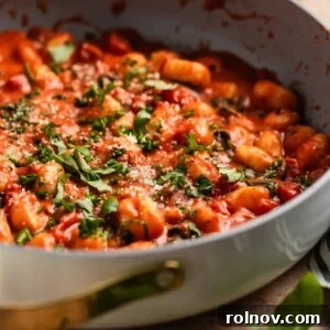 Elevate Your Gnocchi Side Dishes That Shine 4 Creamy tomato basil skillet gnocchi topped with chopped basil and parsley.