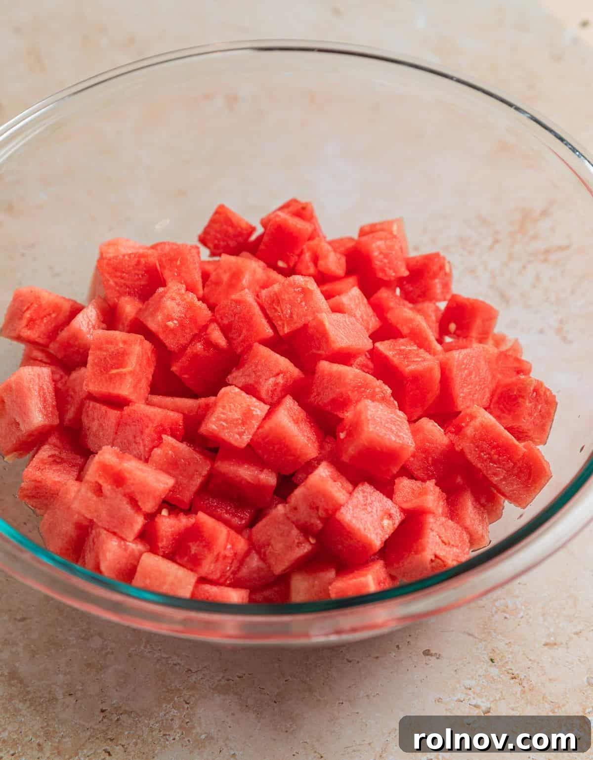 Watermelon Avocado Feta Harmony 4 Perfectly cubed watermelon in a clear glass bowl, ready for the salad.