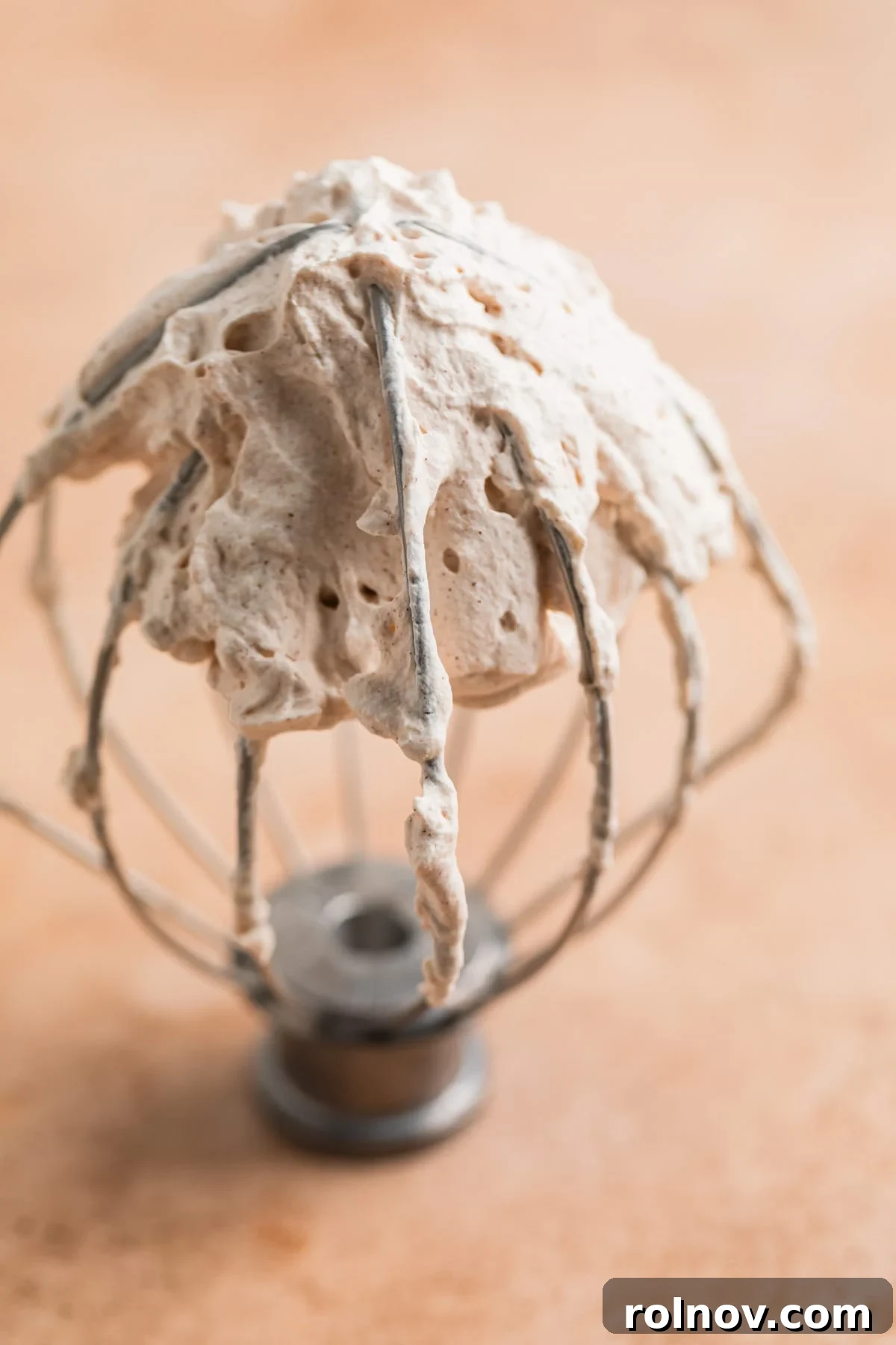 Autumn's Pumpkin Cloud 3 Wire whisk from standing mixer with whipped cream on it.