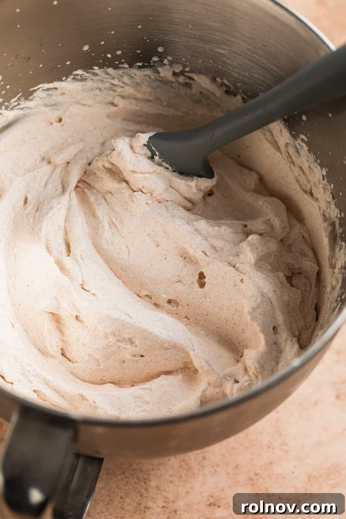 Autumn's Pumpkin Cloud 5 Whipped cream in standing mixer bowl with pumpkin spice mixed in.