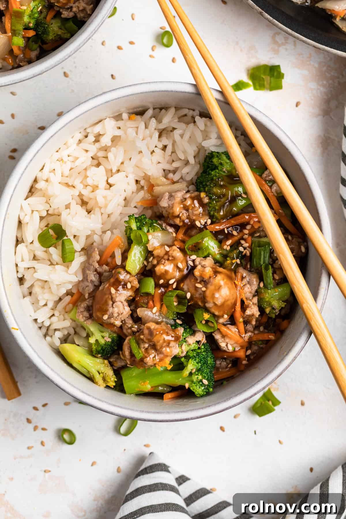 Sticky Teriyaki Pork Stir Fry 11 Overhead view of a bowl of Teriyaki Ground Pork Stir Fry with chopsticks.
