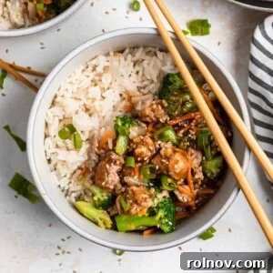Sticky Teriyaki Pork Stir Fry 12 Teriyaki ground pork stir fry in bowl with white rice and chopsticks.