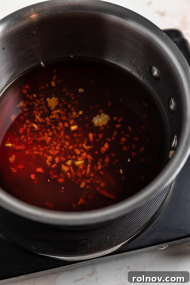Sticky Teriyaki Pork Stir Fry 3 Teriyaki sauce ingredients being combined in a small saucepan.