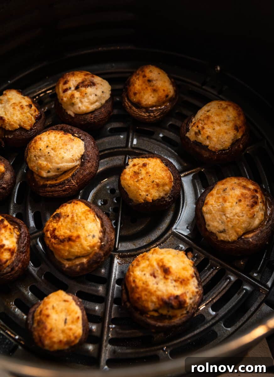 Savory Air Fryer Stuffed Mushrooms 7 Air fryer mushrooms in air fryer basket after cooking.