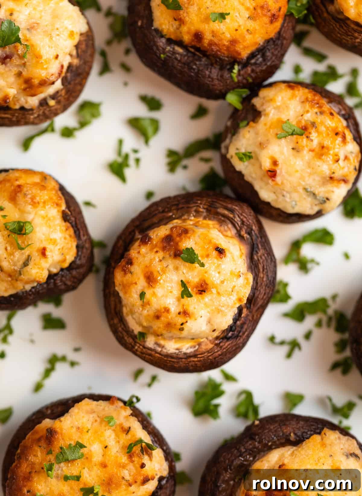 Savory Air Fryer Stuffed Mushrooms 8 Overhead view of air fryer stuffed mushrooms topped with freshly chopped parsley.