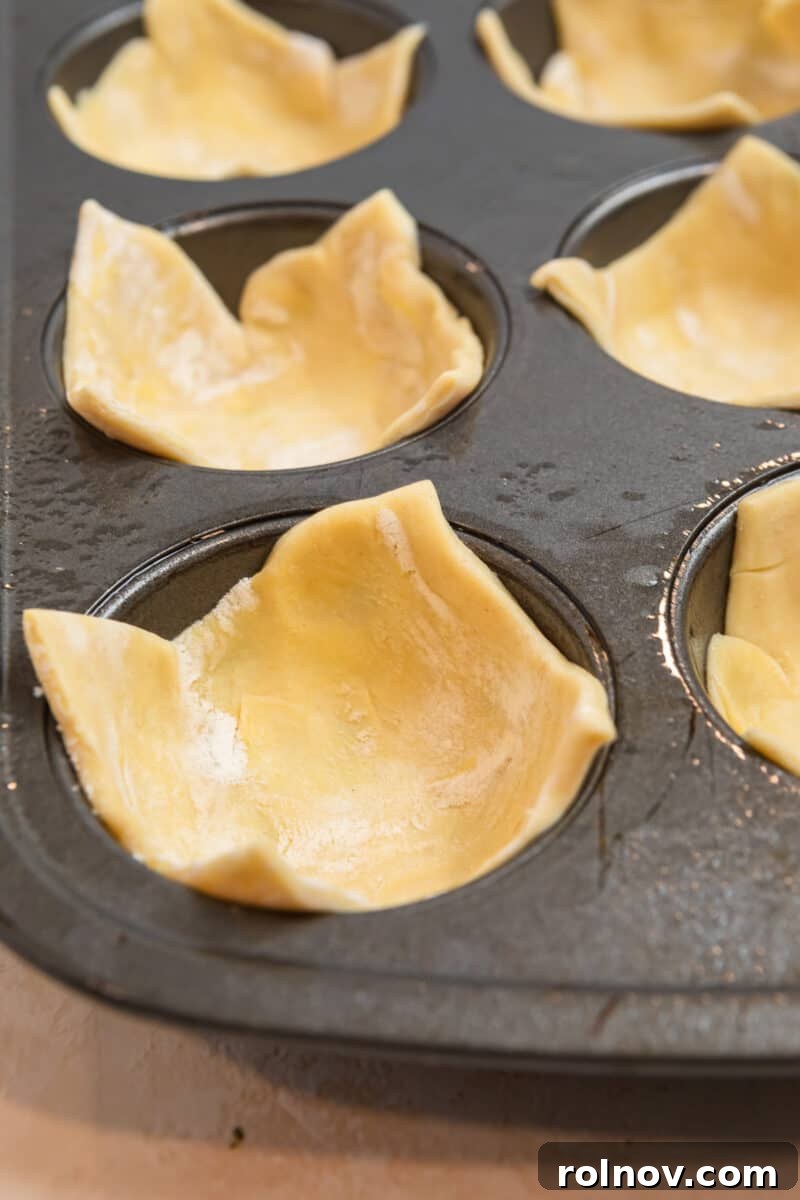 Buttery Flaky Quiche 8 Puff pastry pressed into muffin tin cups.