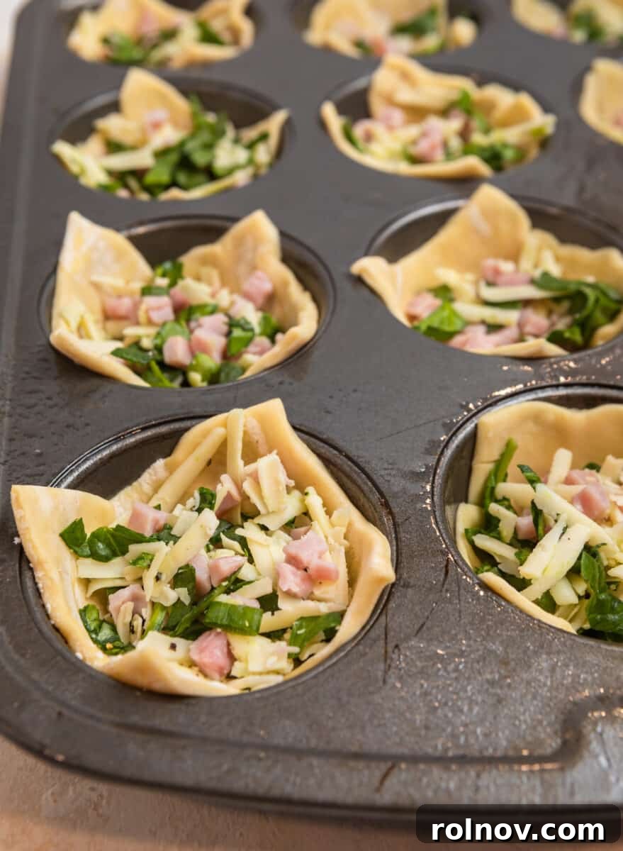 Buttery Flaky Quiche 9 Puff pastry muffin cups filled with ham, cheese and spinach mixture.