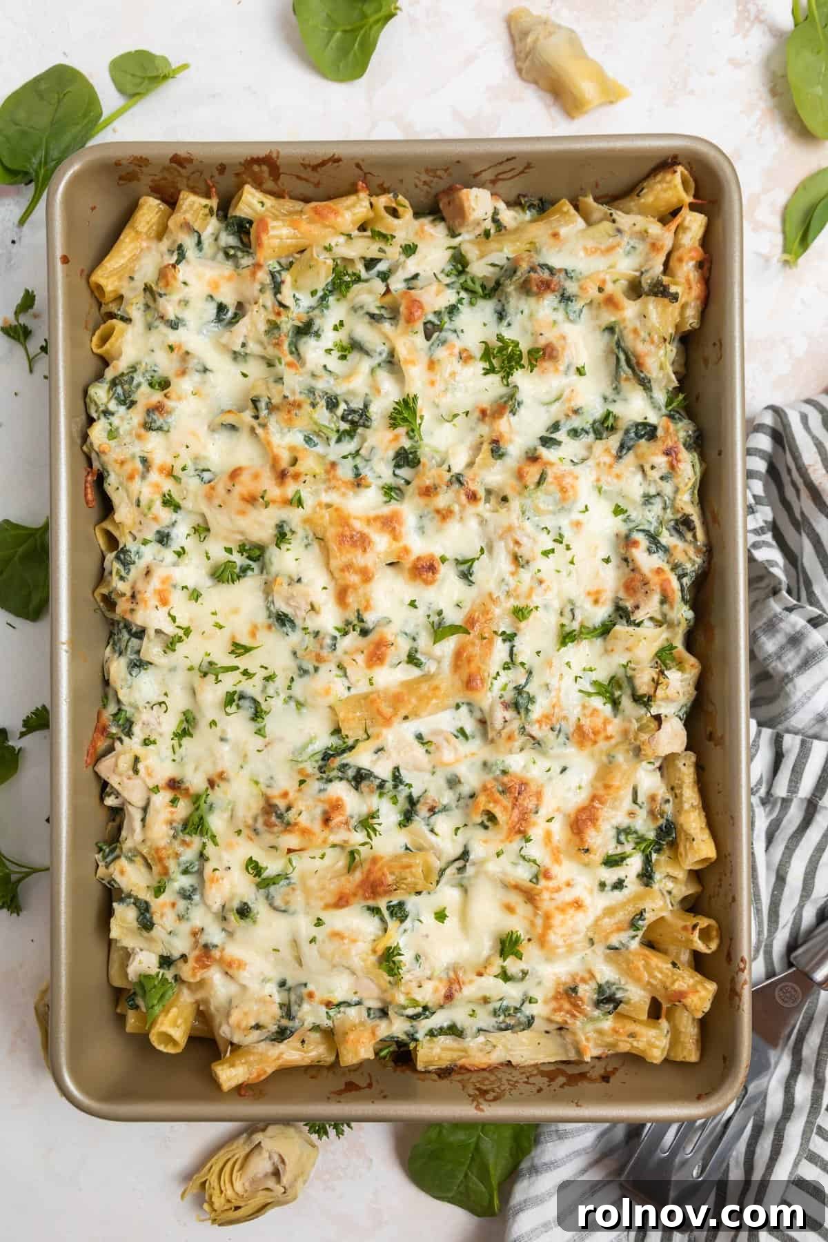 Baked chicken, spinach and artichoke pasta casserole.