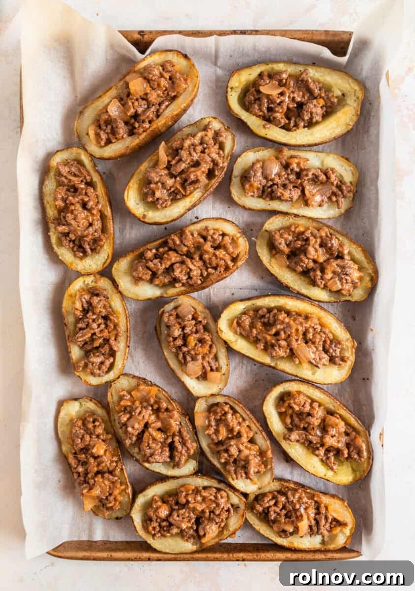 Cheesy Burger Potato Boats 11 Potato skins with cheeseburger mixture stuffed inside.