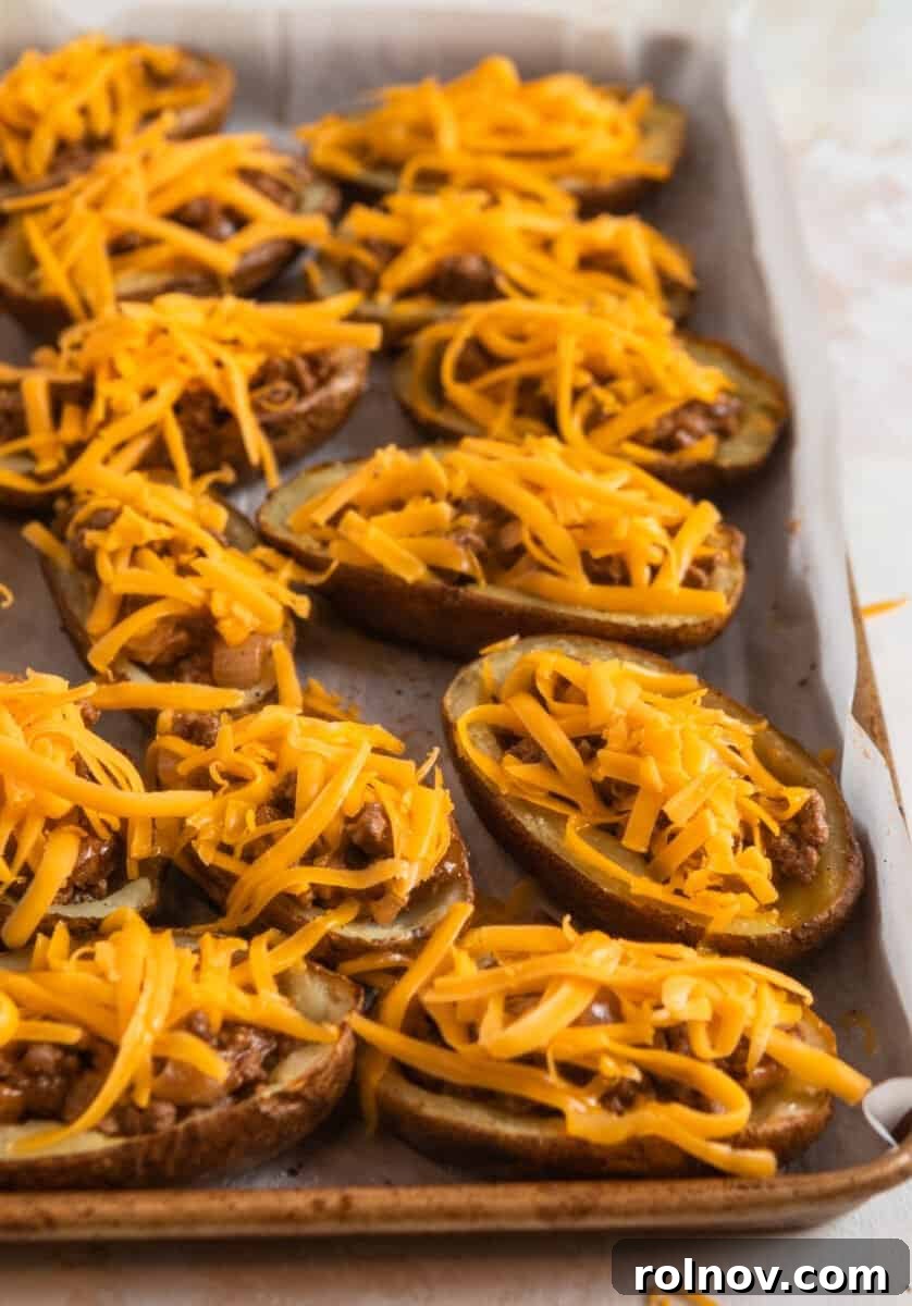 Cheesy Burger Potato Boats 12 Cheese topped cheeseburger potato skins.