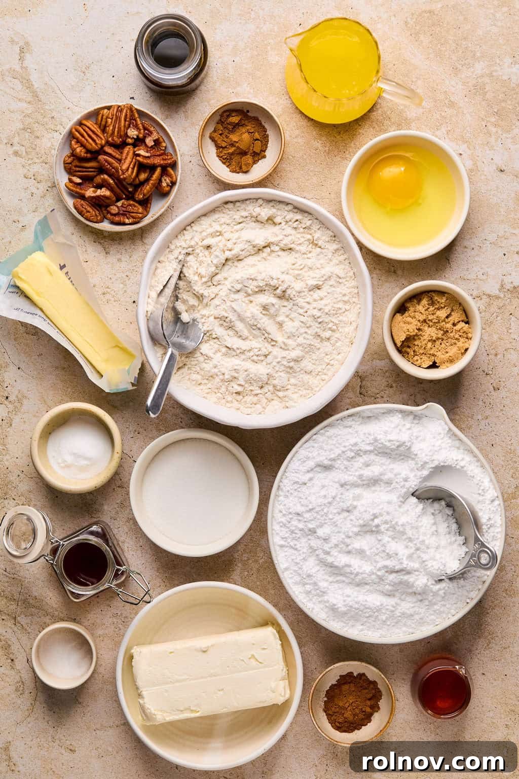 Golden Spiced Molasses Pumpkin Chews 3 Butter, flour, pumpkin spice, cinnamon, molasses and other ingredients arranged on surface..