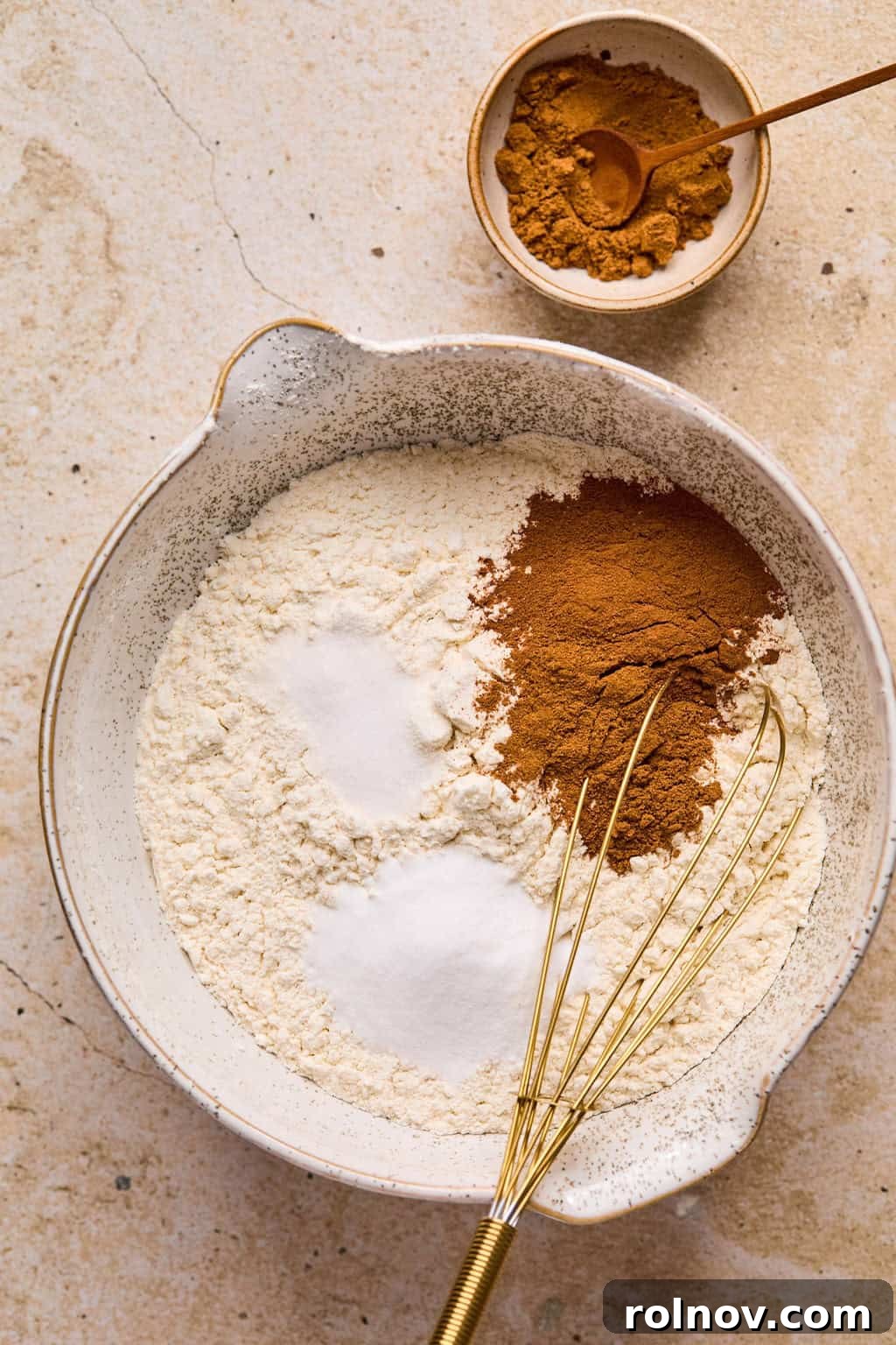 Golden Spiced Molasses Pumpkin Chews 6 Dry ingredients for cookies in mixing bowl with whisk.