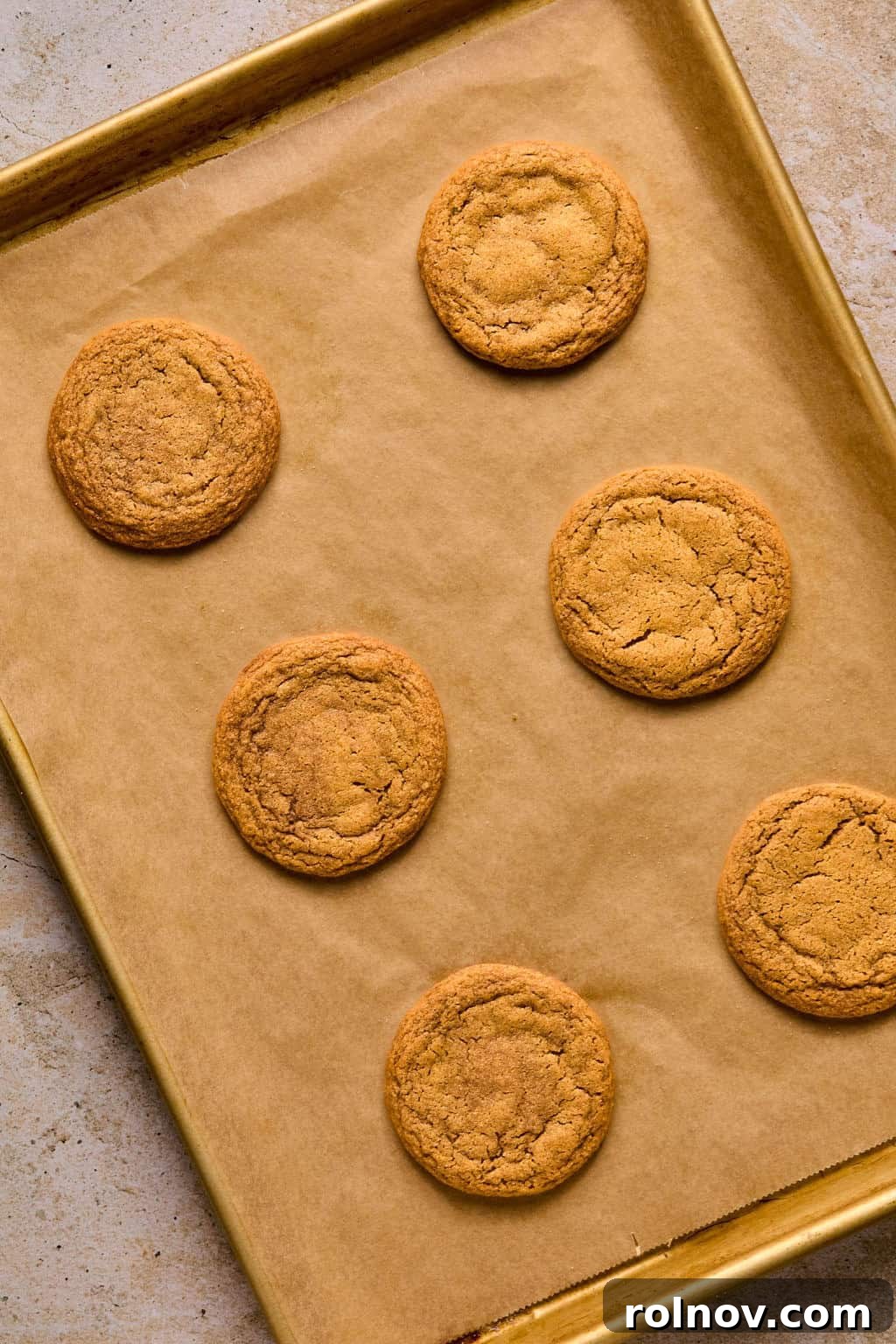 Golden Spiced Molasses Pumpkin Chews 10 Baked pumpkin molasses cookies on baking sheet.