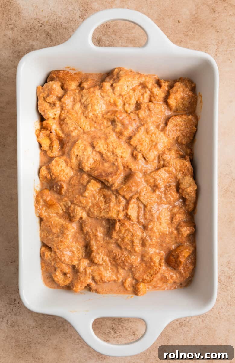 Pumpkin Spice French Toast Bake 6 French toast casserole mixture in greased white pan.
