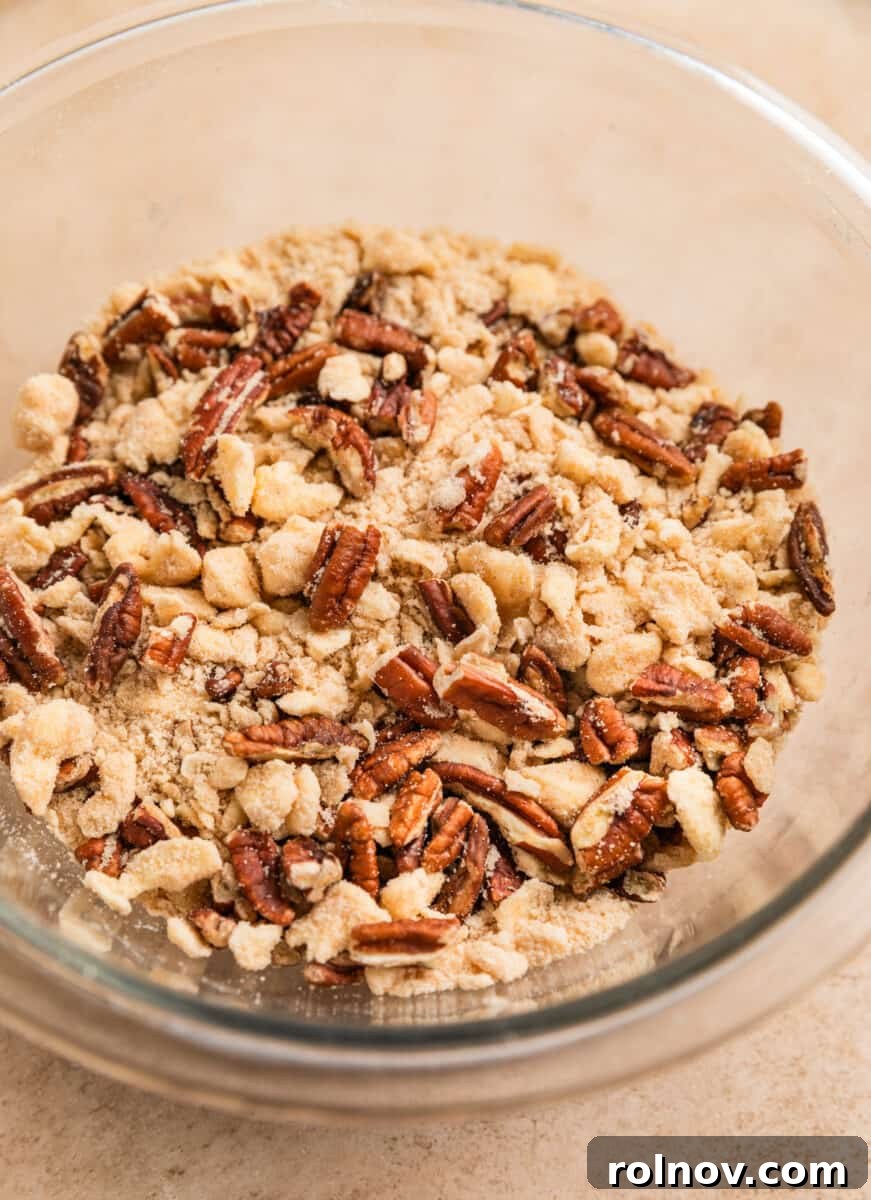 Pumpkin Spice French Toast Bake 8 Pecans and buttery flour mixture in bowl.