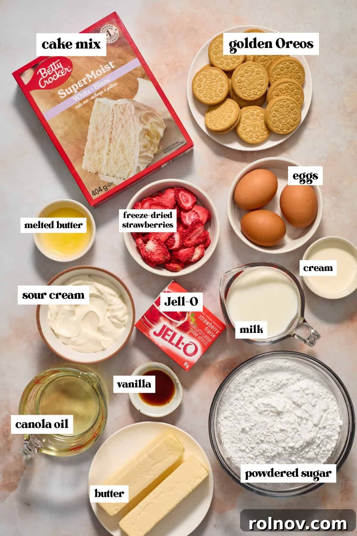 Berry Crunch Bliss Cupcakes 3 Cake mix, strawberry Jell-o mix box, butter, and other baking ingredients laid out for the recipe.
