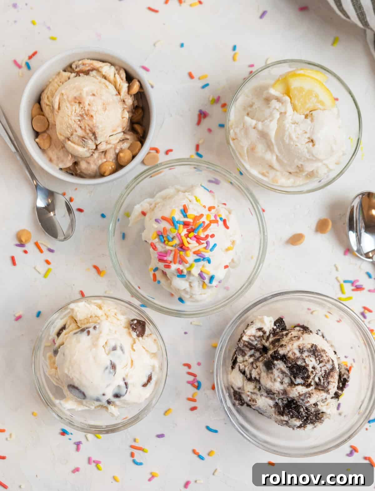 Cottage Cream Dream 3 Five different flavors of cottage cheese ice cream, each in a separate glass with unique toppings, showcasing variety.