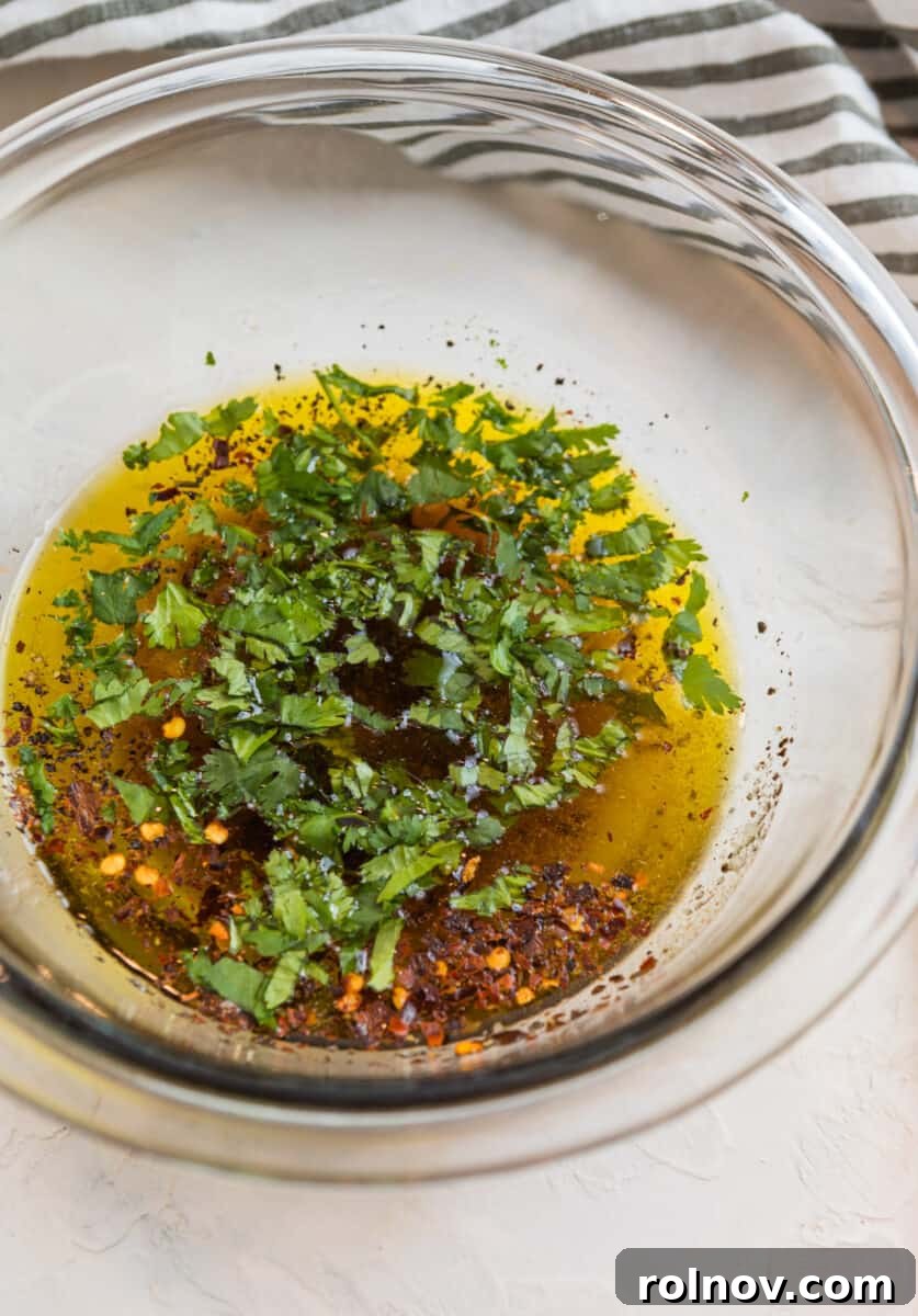 Powerhouse Flank Steak Salad 5 Ingredients for cilantro lime marinade in a glass bowl.