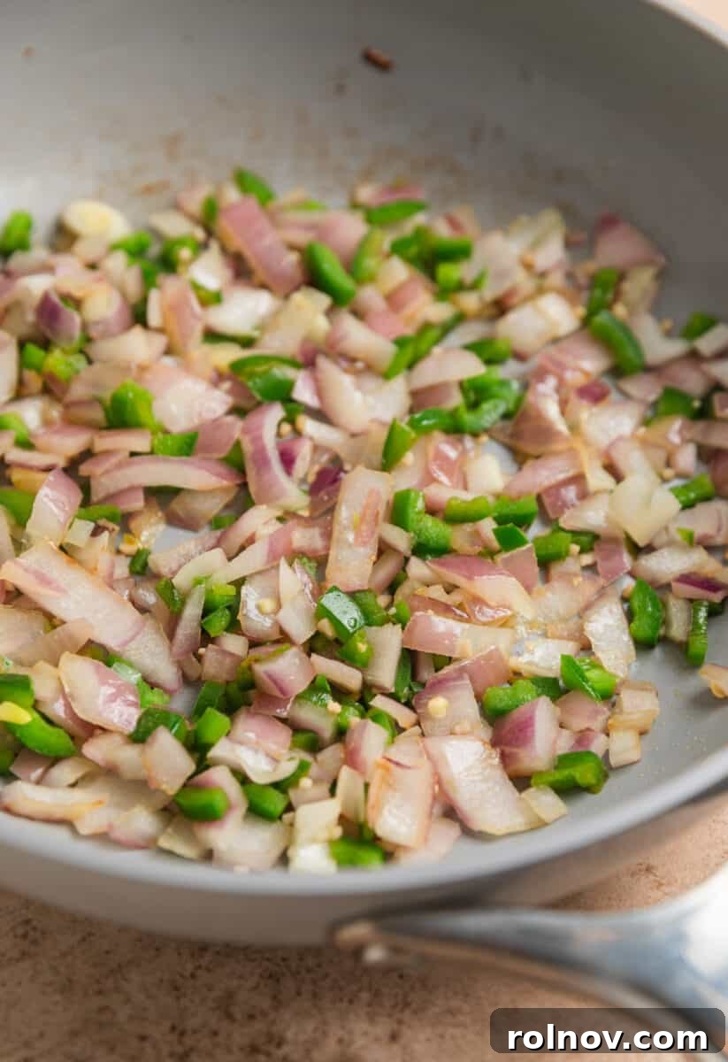 Jalapeño and onion in skillet.