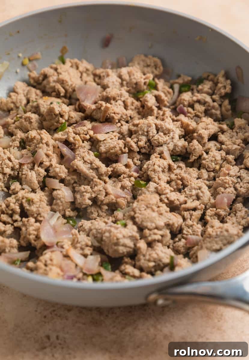 Ground turkey and onions and pepper browned in pan.