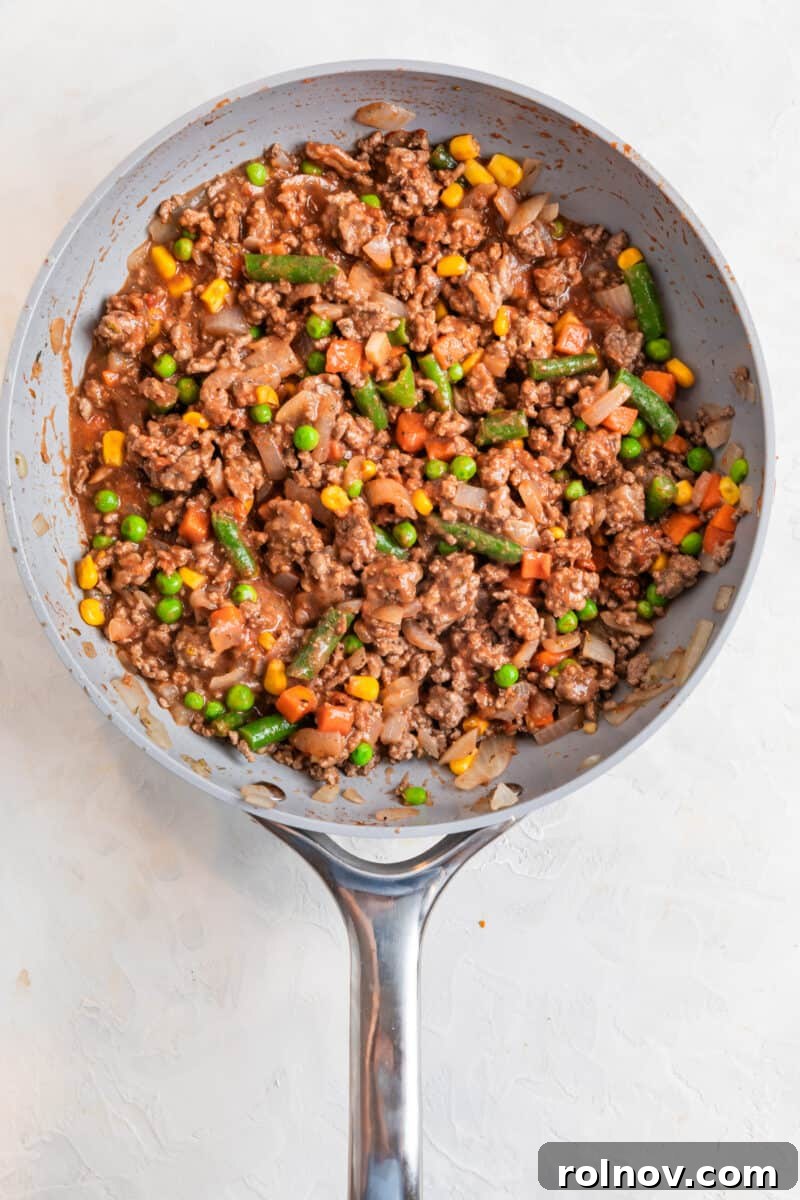 Shepherd's pie mixture cooked in skillet.