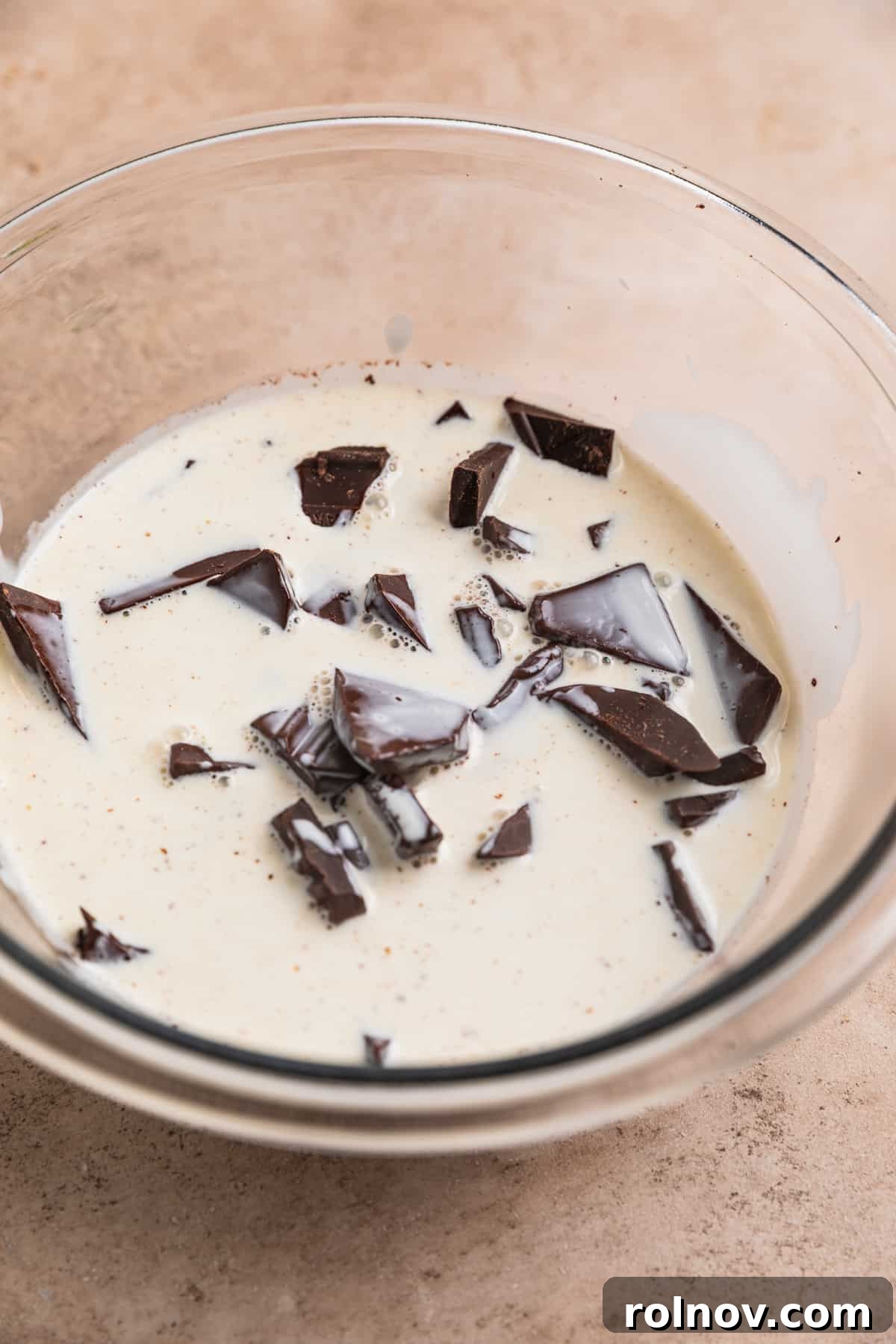 Effortless 5 Ingredient Amaretto Truffles 5 Warm cream poured over dark chocolate in mixing bowl