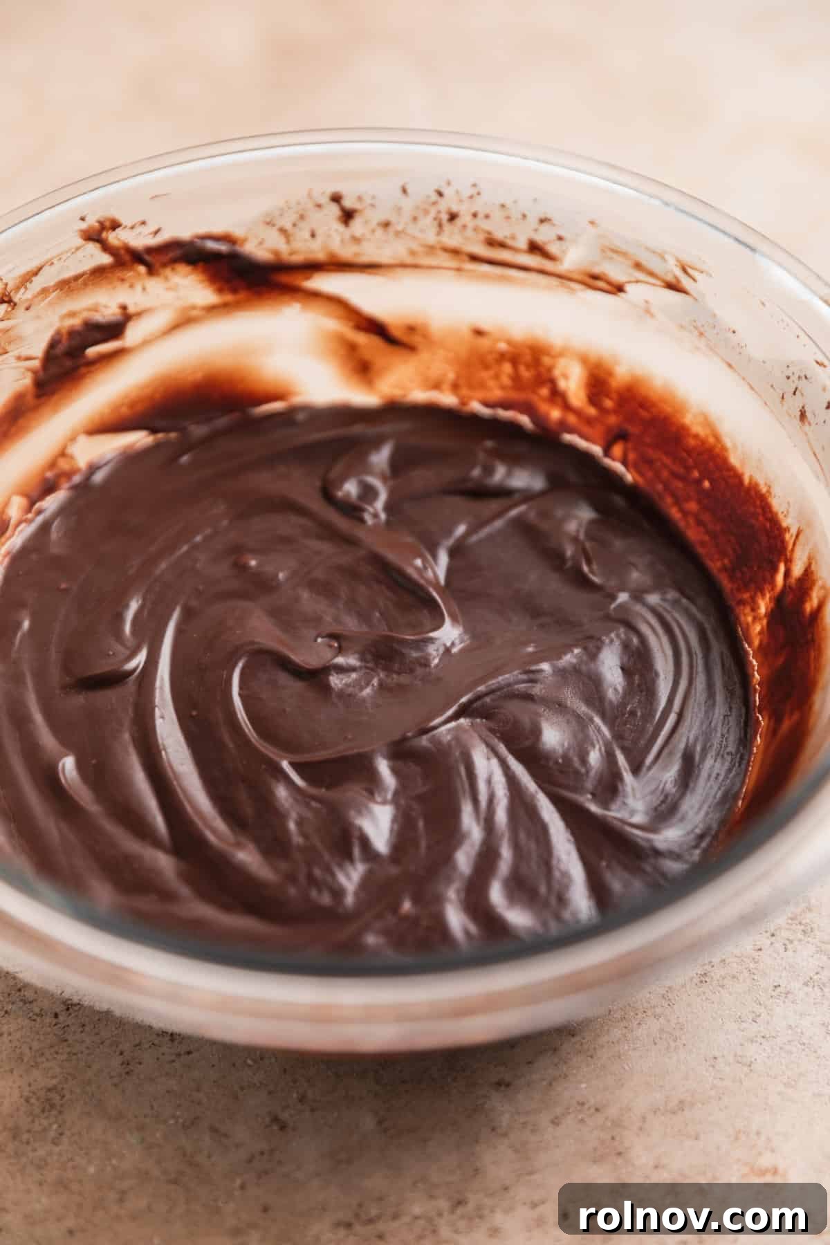 Effortless 5 Ingredient Amaretto Truffles 7 Hardened chocolate ganache in mixing bowl.