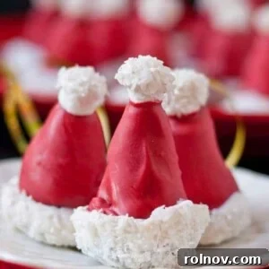 Adorable Oreo Cookie Ball Santa Hats, complete with white whipped cream 'fur' and a red hat.