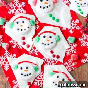 Charming white chocolate bark designed to look like a melted snowman on a Christmas towel.