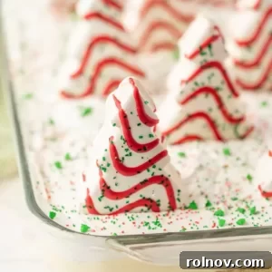 A festive Christmas Dirt Cake, topped with charming Christmas tree cakes.